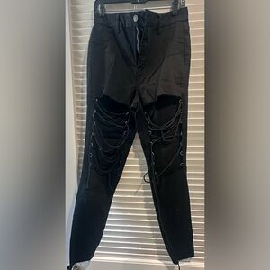 Black skinny cropped jeans with cut outs on thighs SIZE 11